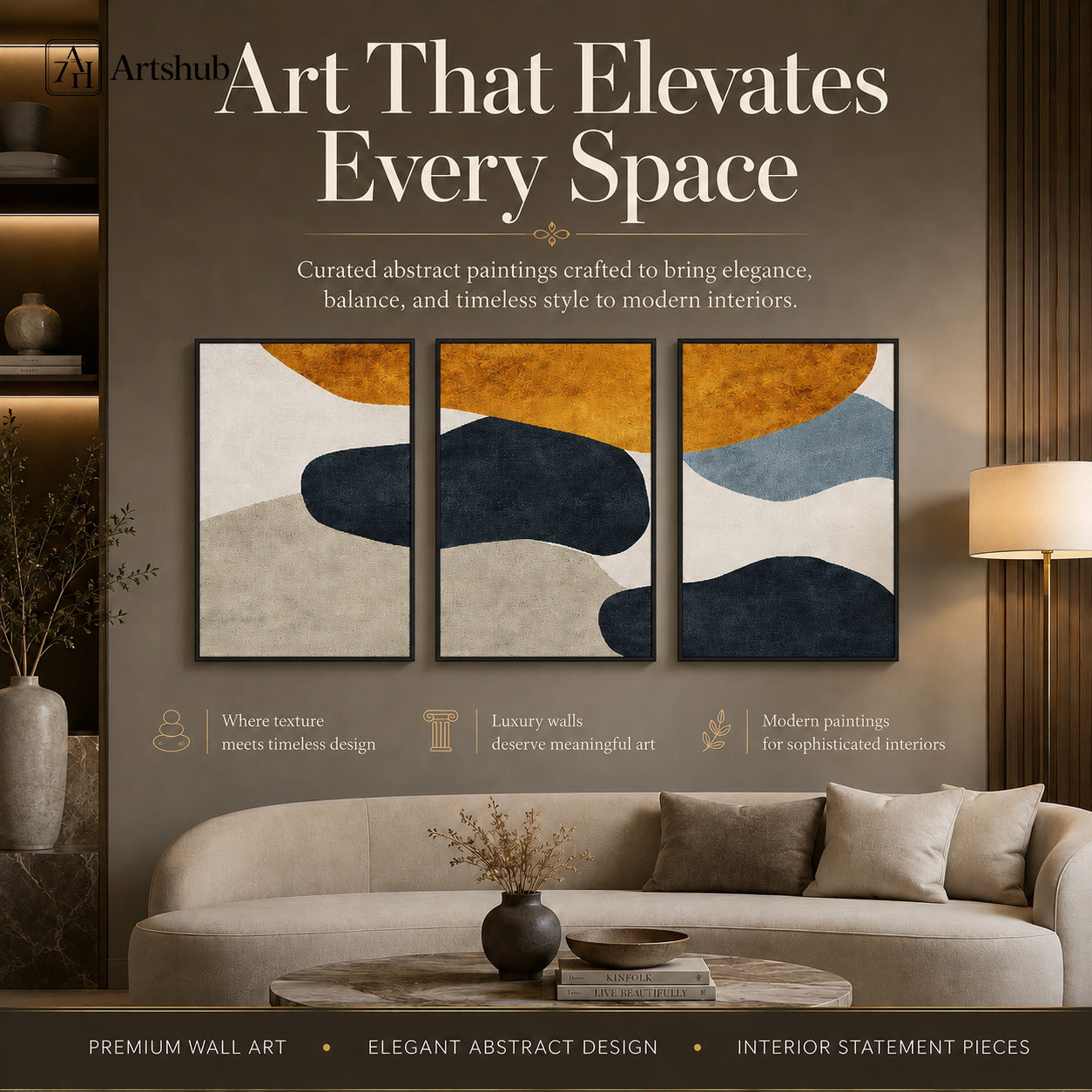 Artshub Amber Stone – Art That Elevates Every Space editorial banner – 3-panel triptych abstract canvas wall art on warm dark wall above cream curved sofa with round marble coffee table with black vase and books – Where Texture Meets Timeless Design, Luxury Walls Deserve Meaningful Art, Modern Paintings for Sophisticated Interiors – Premium Wall Art, Elegant Abstract Design, Interior Statement Pieces