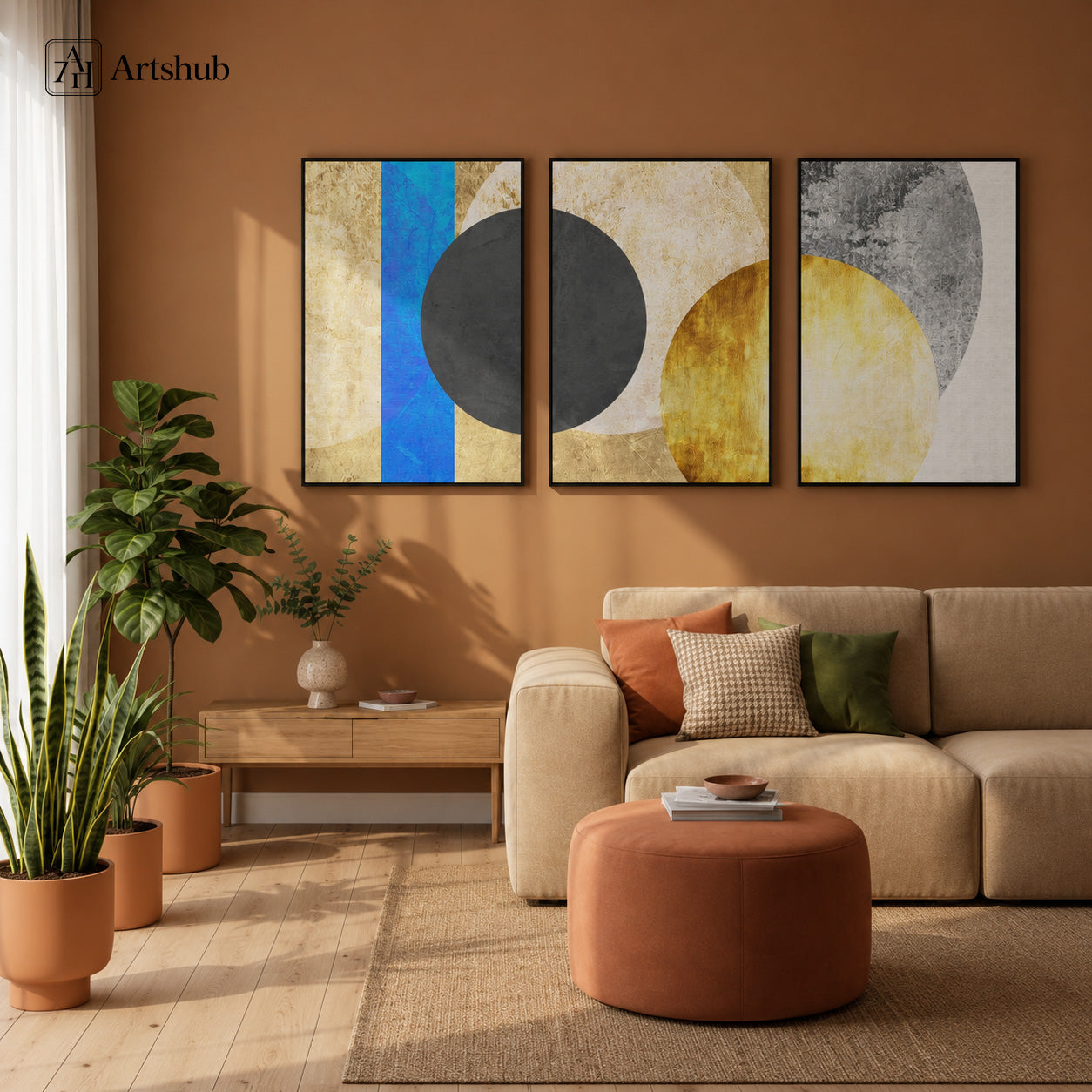 Artshub Abstract Geometric Eclipse triptych 3 panel framed canvas wall art in warm terracotta living room above beige sofa with indoor plants