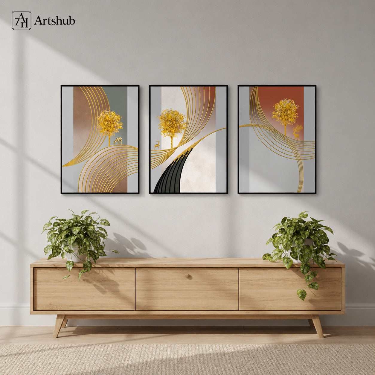 Artshub Golden Serenity Tree Gold Line triptych 3 panel framed canvas wall art above oak TV unit in Scandinavian living room with trailing pothos plants natural light — gold ivory terracotta