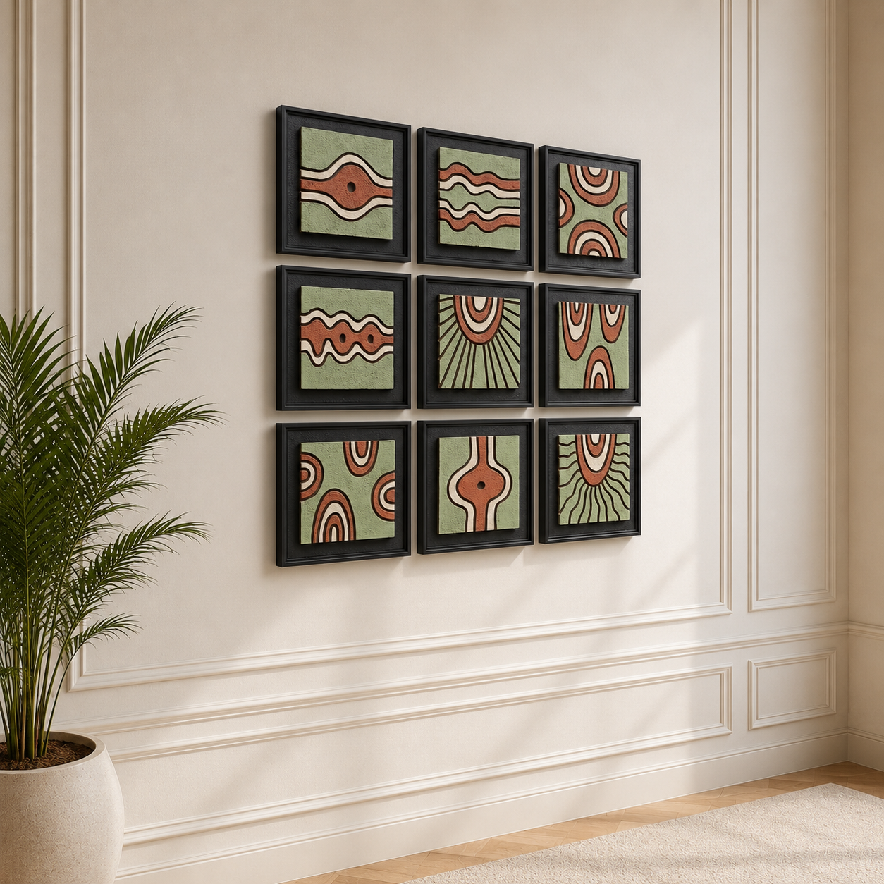 Artshub Sage & Terra 9-panel handcrafted 3D relief framed wall art set displayed in a 3x3 grid on a cream panelled wall above a luxury beige desk with Mac laptop, black desk lamp, gold sphere floor lamp and fiddle leaf fig plant – contemporary design timeless elegance