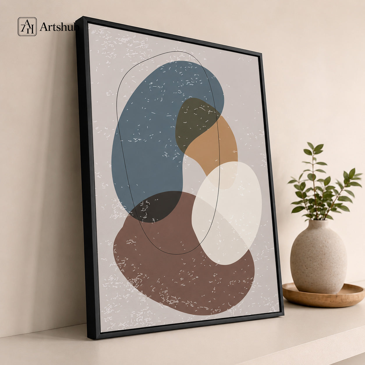 Artshub Quiet Harmony Steel Blue Warm Brown Ivory Abstract Organic Shapes single panel framed canvas wall art leaning on warm cream shelf with round ceramic vase green plant wooden tray — steel blue brown ivory matte black frame
