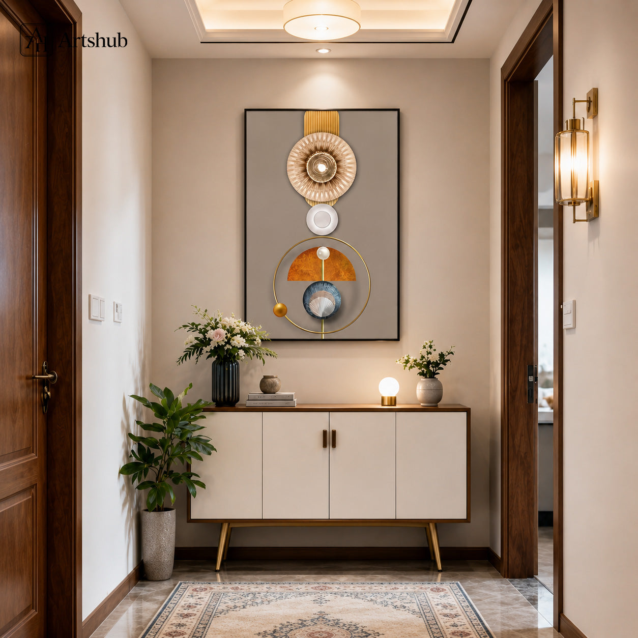 Artshub Celestial Harmony Gold Sunburst Geometric Sculptural single panel framed canvas wall art above white console in warm Indian entryway with dark wood doors brass wall sconce white flower vase globe lamp — gold sunburst burnt orange steel blue matte black frame