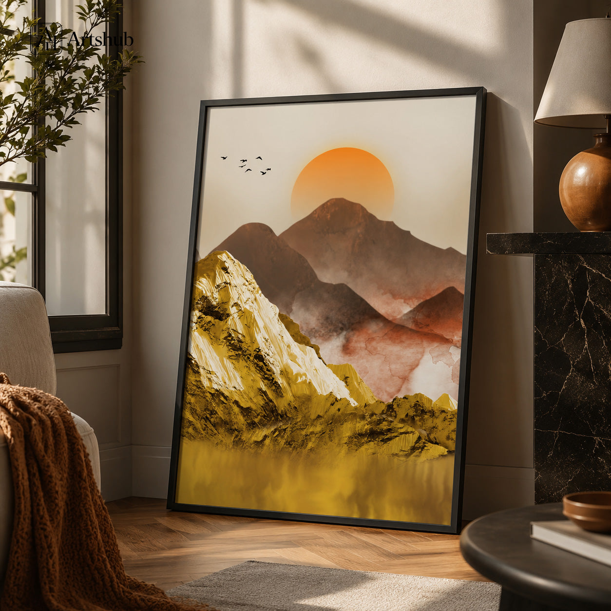 Artshub Golden Mountain Serenity Orange Sun 3D Gold Impasto Mountain Misty Range Still Water single panel framed canvas wall art leaning on warm cream wall in luxury living room with cream armchair rust throw black marble fireplace wooden lamp olive tree natural window light — orange sun gold impasto mountain matte black frame