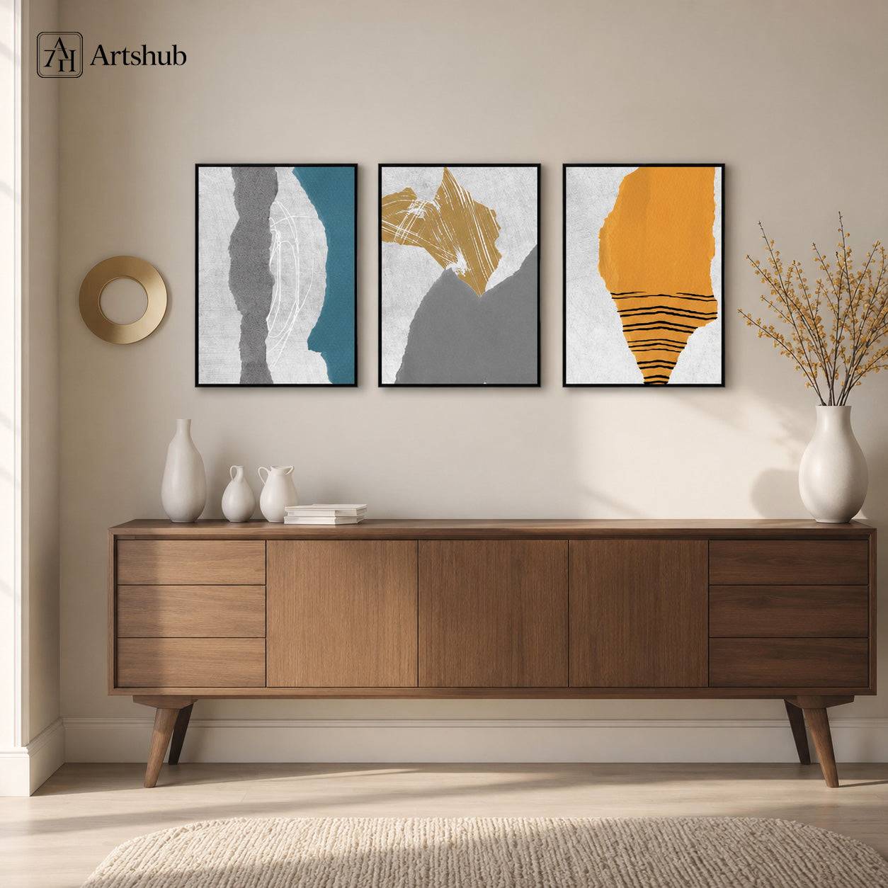 Artshub Abstract Teal Grey Amber triptych framed canvas wall art above walnut sideboard in bright Scandinavian living room with white vases and dried branch arrangement