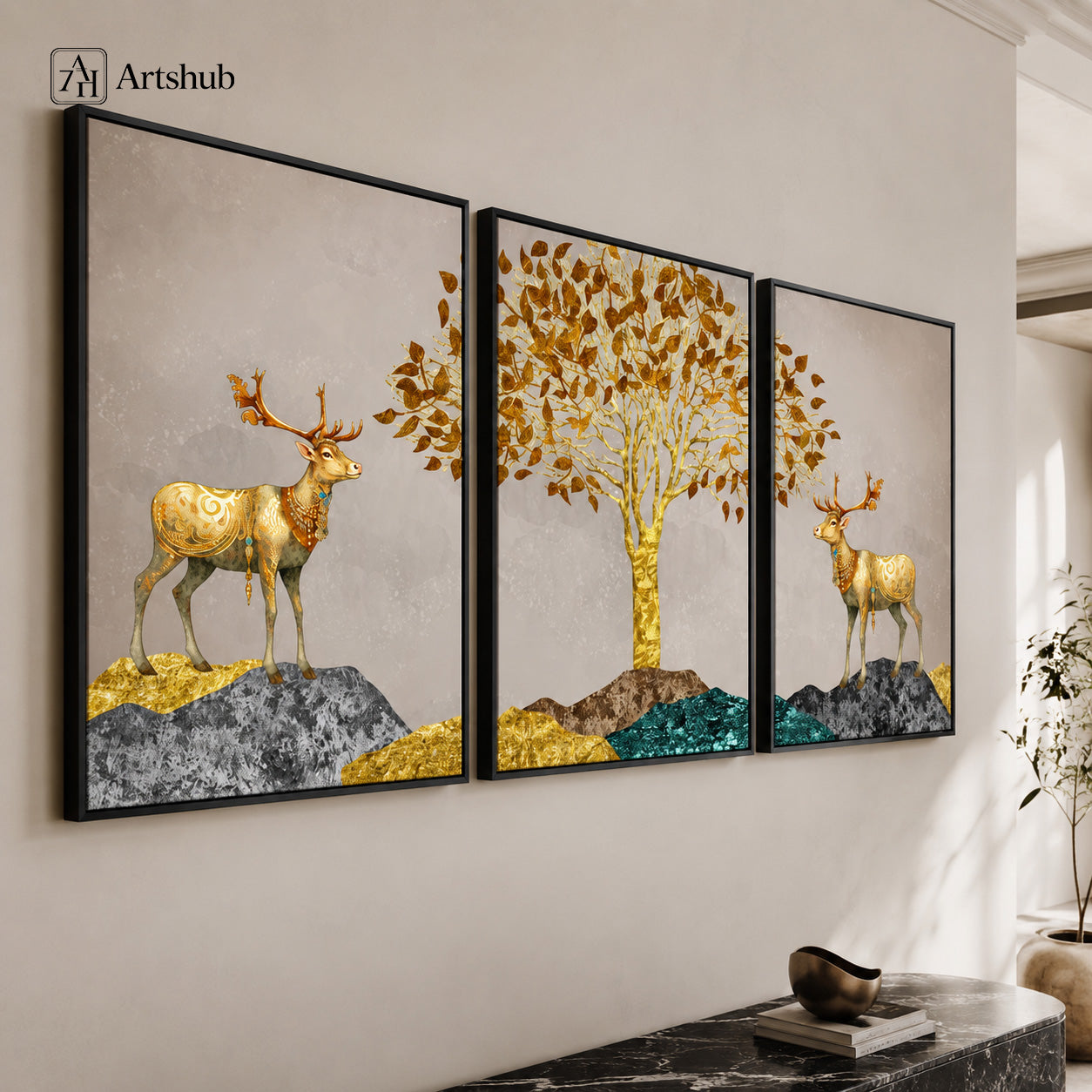 Artshub Golden Deer Amber Leaf Tree triptych 3 panel framed canvas wall art on warm cream wall above black marble console with decorative bowl — golden deer amber leaf tree teal gold matte black frame