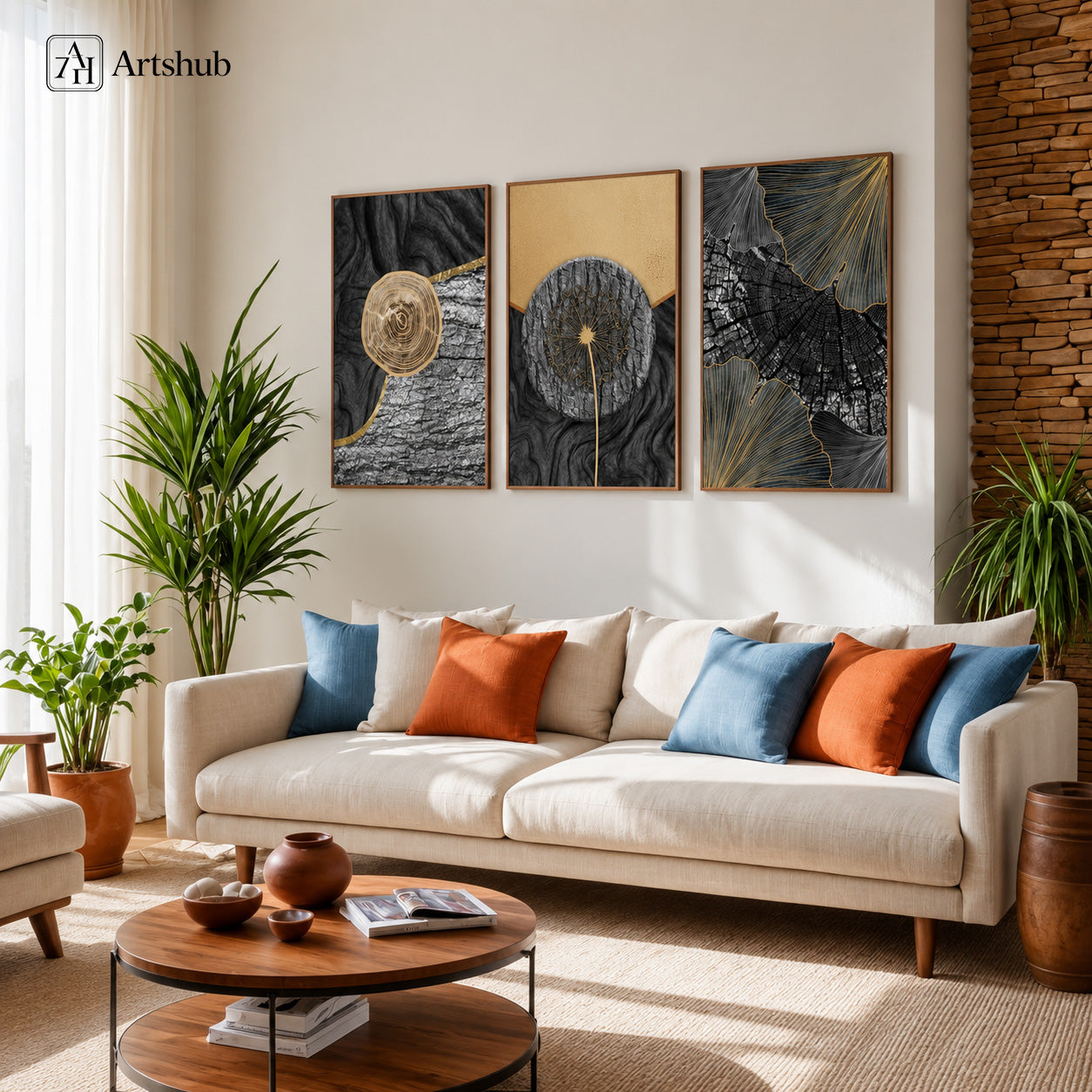 Artshub Dark Gold Textured Dandelion triptych 3 panel framed canvas wall art in bright Boho living room above cream sofa with blue and terracotta cushions tropical plants brick wall — charcoal gold walnut frame