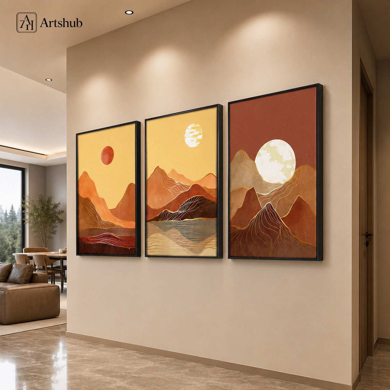 Artshub Terracotta Mountain Sunset Gold Line triptych 3 panel framed canvas wall art in warm modern entryway on cream wall with recessed lighting and leather sofa — terracotta amber matte black frame