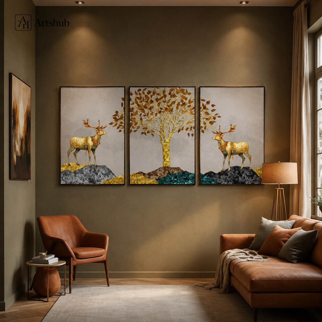 Artshub Golden Deer Amber Leaf Tree triptych 3 panel framed canvas wall art in warm olive living room above cognac leather sofa and armchair with floor lamp — golden deer amber leaf teal gold matte black frame