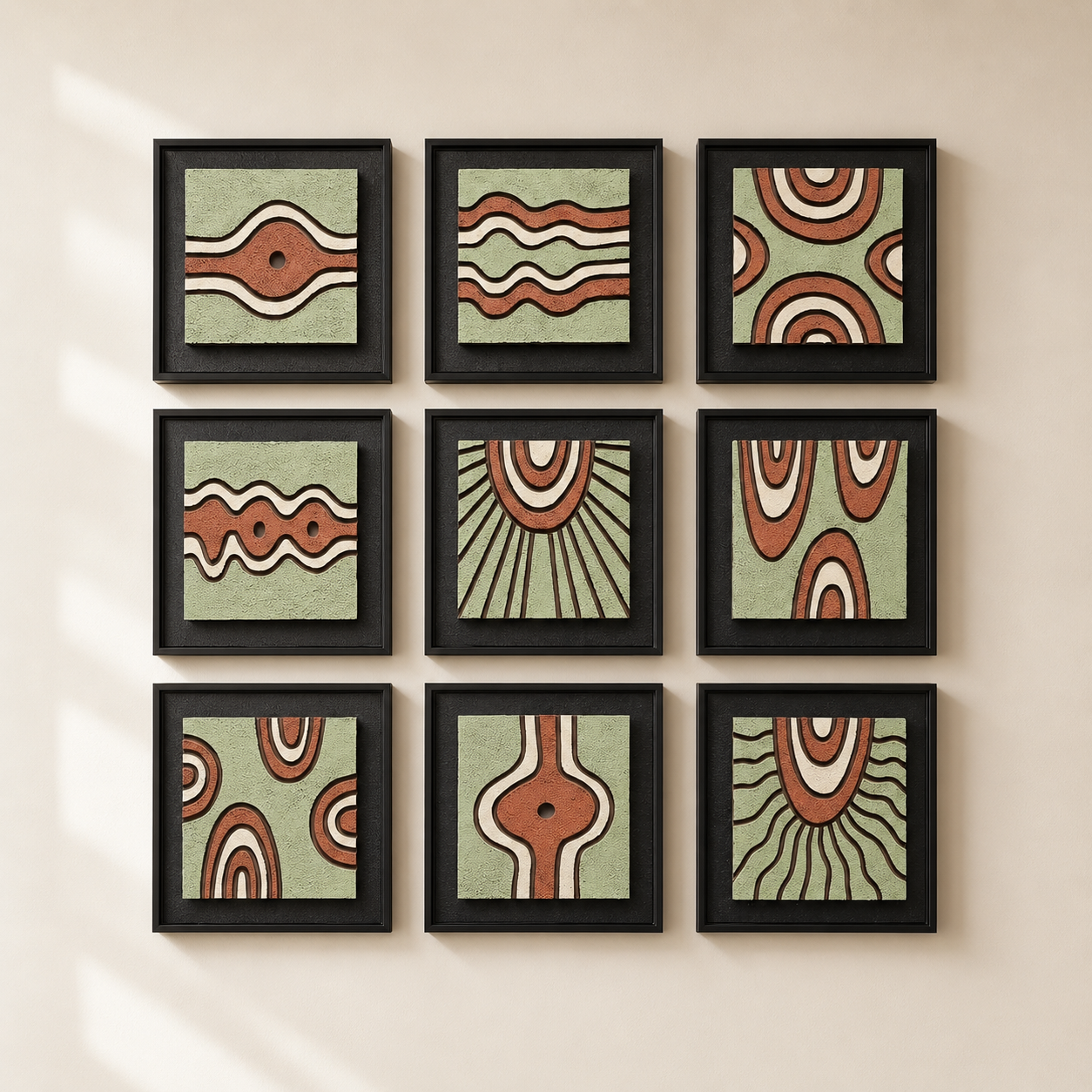 Artshub Sage & Terra 9-panel handcrafted 3D relief framed wall art set displayed in a 3x3 grid on a cream panelled hallway wall with large palm plant in white pot and cream rug – handcrafted texture premium framing contemporary design